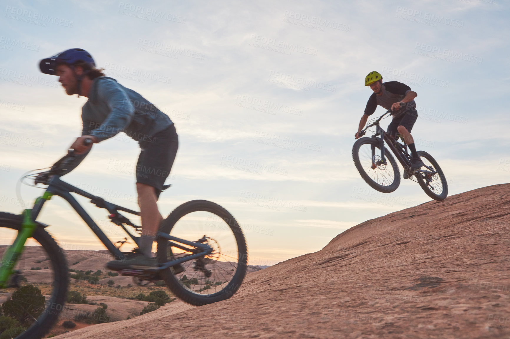 Buy stock photo Full length shot of two men out mountain biking together during the day