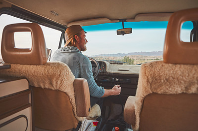 Buy stock photo Cropped shot of a man looking happy while out on a road trip