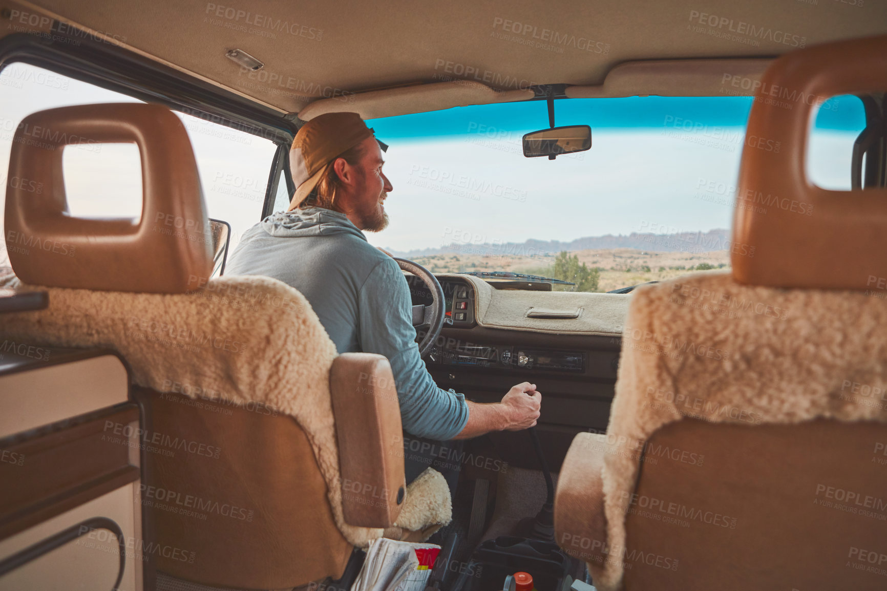 Buy stock photo Cropped shot of a man looking happy while out on a road trip