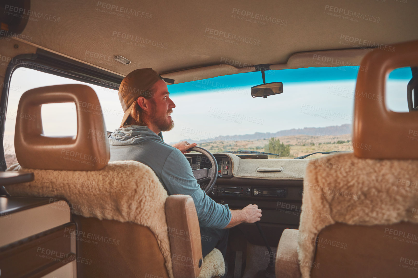 Buy stock photo Cropped shot of a man looking happy while out on a road trip