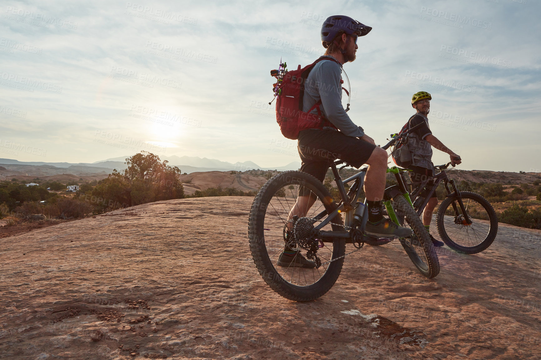 Buy stock photo Full length shot of two men out mountain biking together during the day