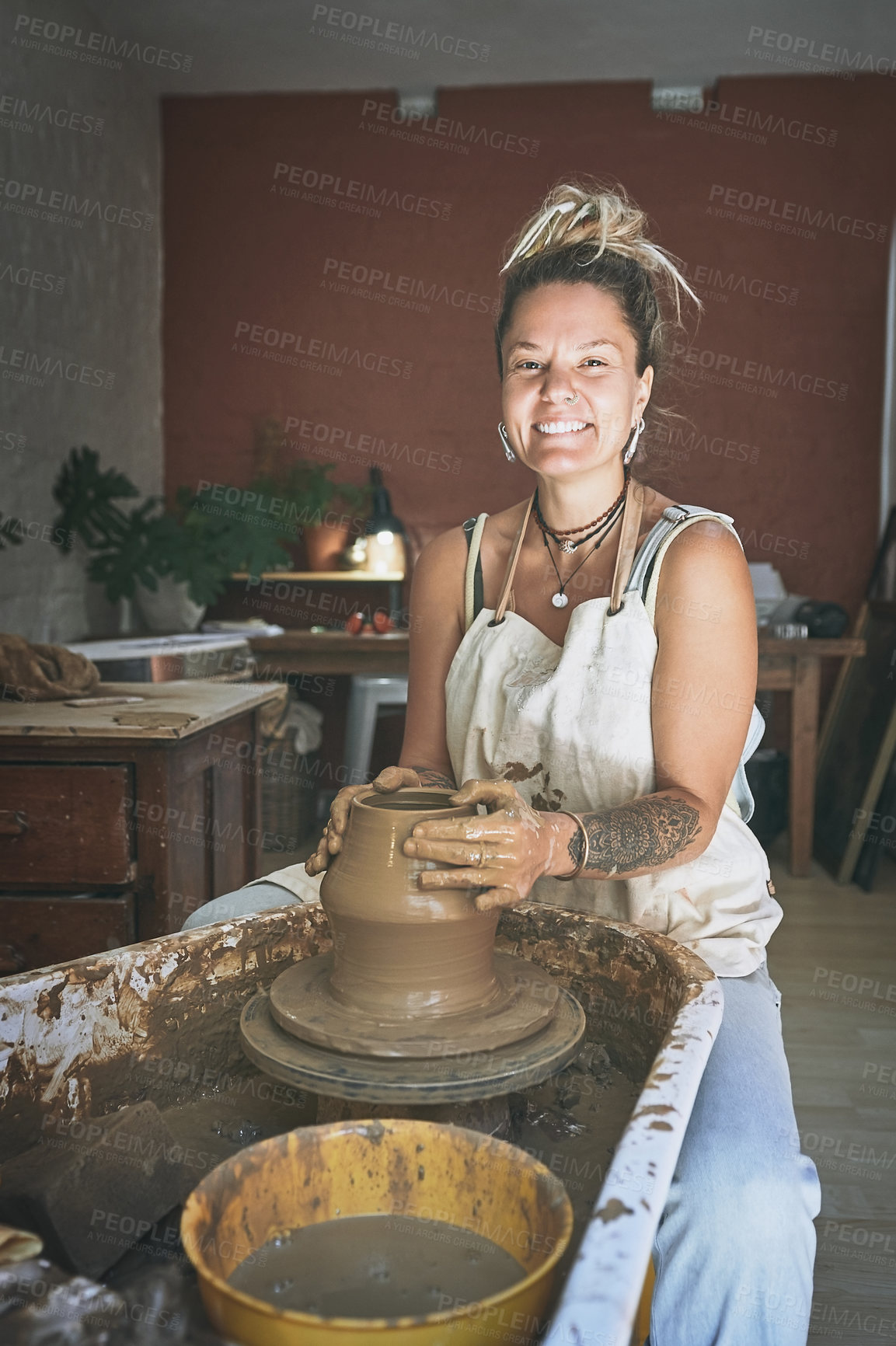 Buy stock photo Portrait, woman and mold in pottery studio with wheel machine, smile and project for small business. Happy, person and artist in workshop with clay sculpture, art and ceramic production for company.