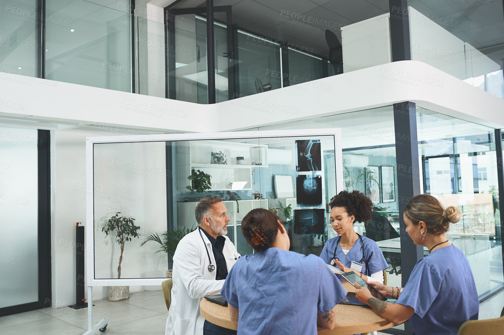 Buy stock photo Doctor, consultation and meeting with nurse in office for medical research, feedback or brainstorming. Healthcare, people and xray with planning for orthopedic, internship or review of treatment plan