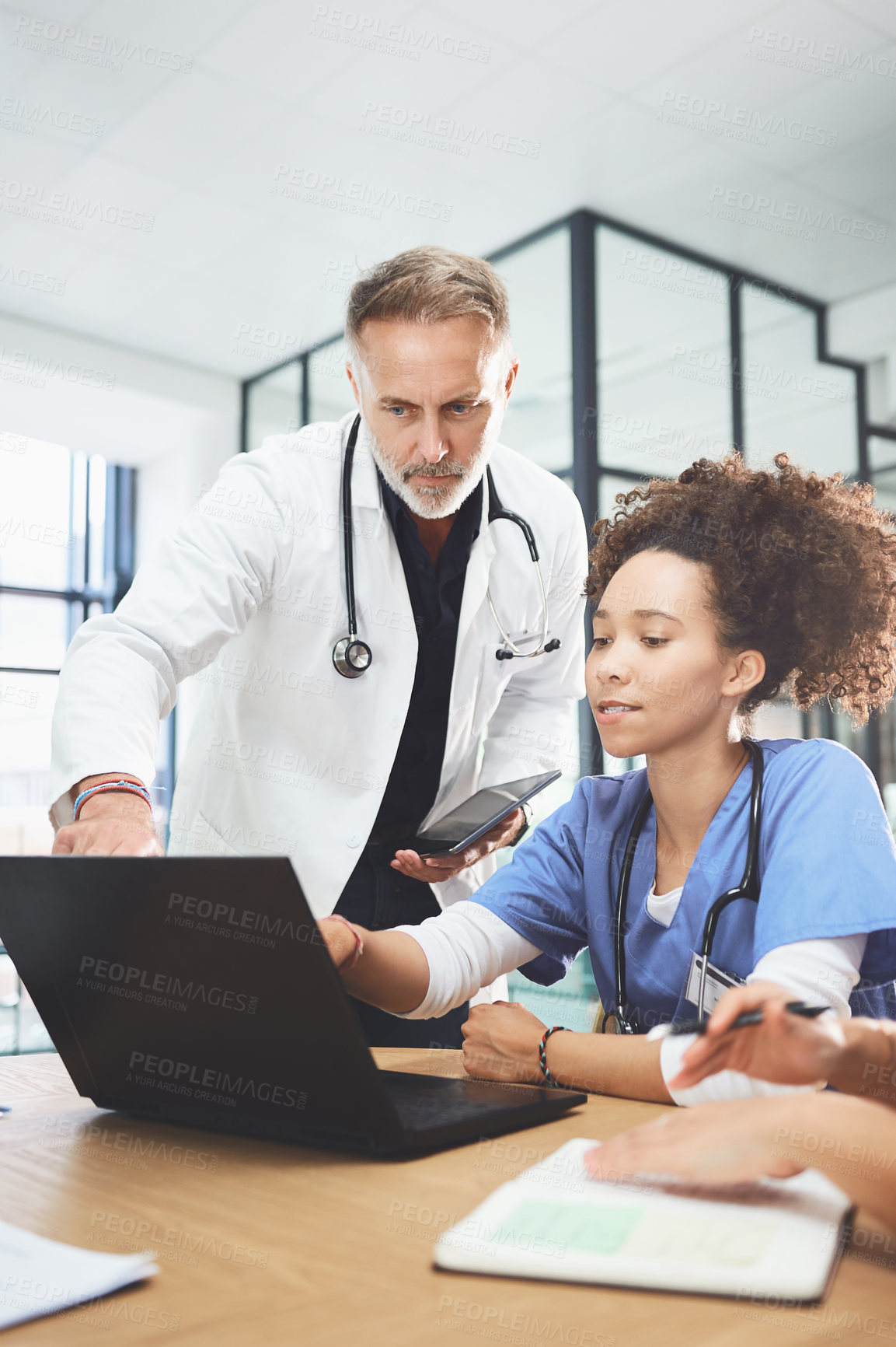 Buy stock photo Laptop, nurse and doctor in meeting for training, healthcare or help with report in hospital. Medical team, man or woman with computer for discussion, treatment plan or coaching with mentor in clinic