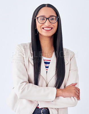 Buy stock photo Studio portrait of a young woman posing against a white background