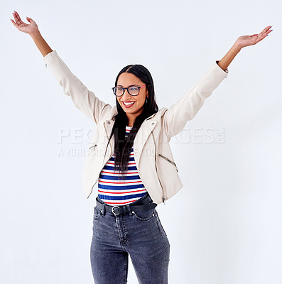 Buy stock photo Studio shot of a young woman cheering while posing against a white background