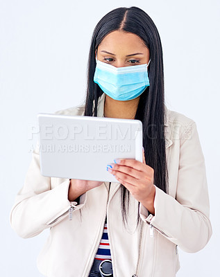 Buy stock photo Business, mask and woman with tablet, typing and company regulations on white studio background. Person, model and employee with tech, face cover and internet for fake news and covid vaccine info