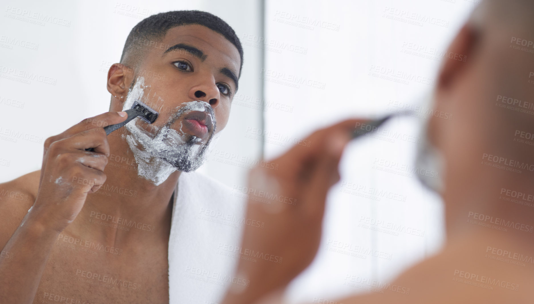 Buy stock photo Man is shaving with cream, mirror and beauty, hair removal for hygiene and grooming during morning routine at home. Male person in bathroom, razor to shave and foam with  fresh and clean skincare