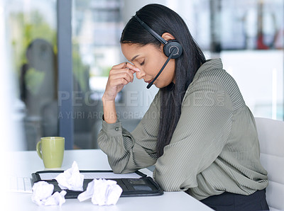 Buy stock photo Stress, frustrated and woman in call center with burnout, crisis or crumpled paper for ideas. Mental health, fatigue and telemarketing consultant at desk with headset, brain fog or headache in office