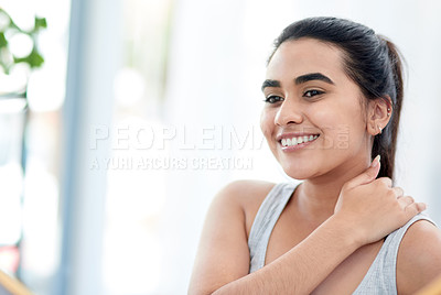 Buy stock photo Shot of young woman smiling happily