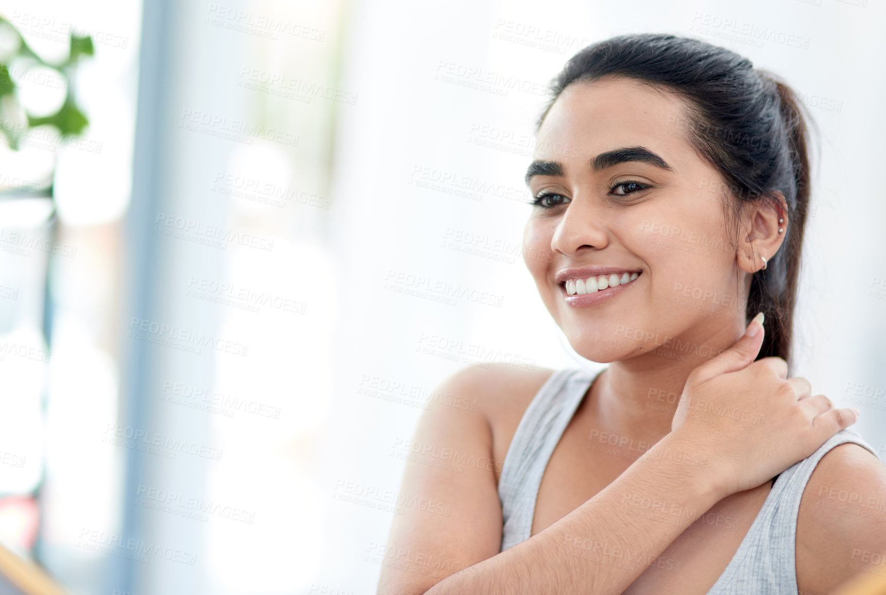 Buy stock photo Shot of young woman smiling happily