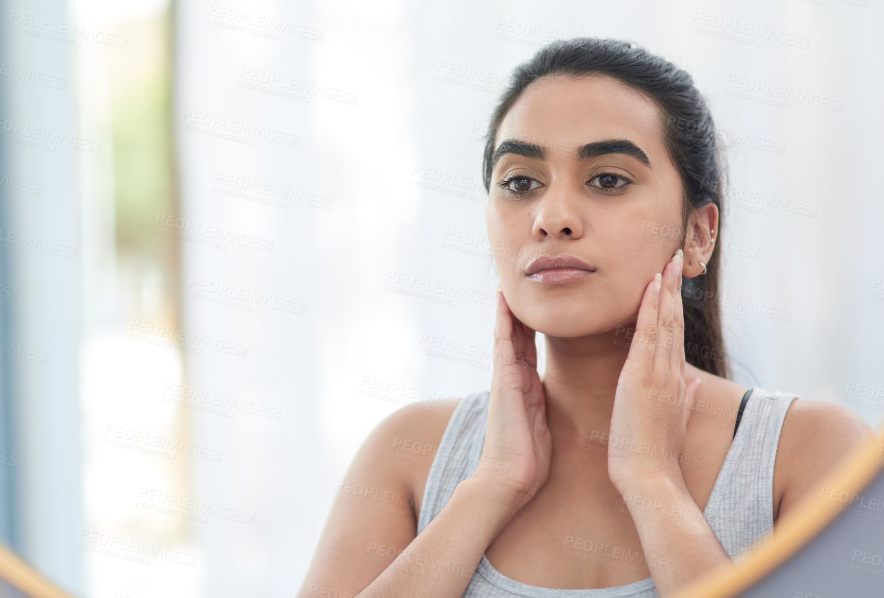 Buy stock photo Face, skincare and reflection of woman in mirror of bathroom for aesthetic cosmetics or vitamin c. Beauty, collagen and dermatology with serious person in apartment for antiaging wellness routine