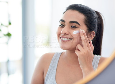 Buy stock photo Beauty, cream and reflection of woman in mirror of bathroom for cosmetics, skincare or vitamin c. Face, lotion or dermatology and happy person with smile in home for antiaging wellness routine