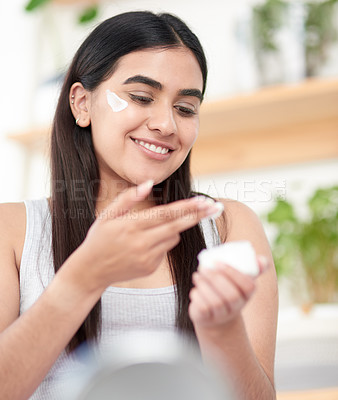 Buy stock photo Beauty, face cream and woman with skincare in bathroom for health, wellness and treatment at home. Smile, cosmetic and female person with facial dermatology creme, lotion or spf for routine at house.