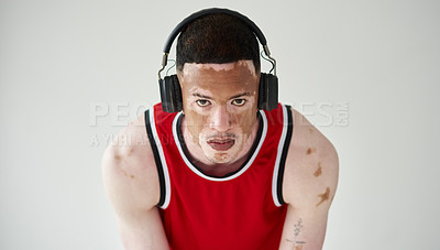 Buy stock photo Man, portrait and fitness with headphones in studio for music listening, vitiligo and workout. Unique skin, basketball player and health by white background with headset for training body and audio