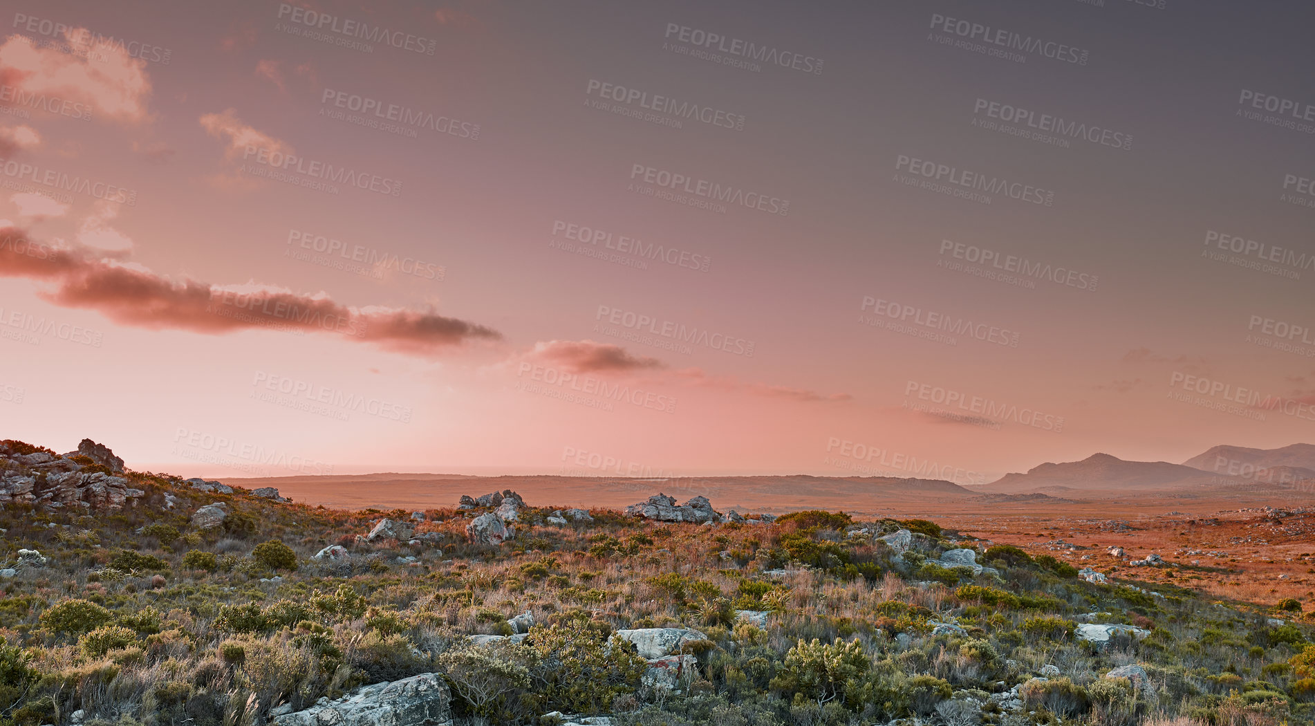 Buy stock photo Sunset, nature and landscape of rocks outdoor by space for sustainability with natural field. Plants, clouds and greenery in eco friendly environment for destination or travel in spring season.