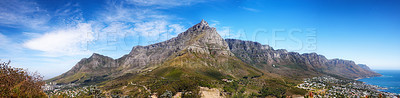 Buy stock photo Landscape panorama of mountains, sea and coastal city with blue sky in famous travel and tourism destination. Copy space and scenic nature view of Table Mountain reserve in Cape Town, South Africa