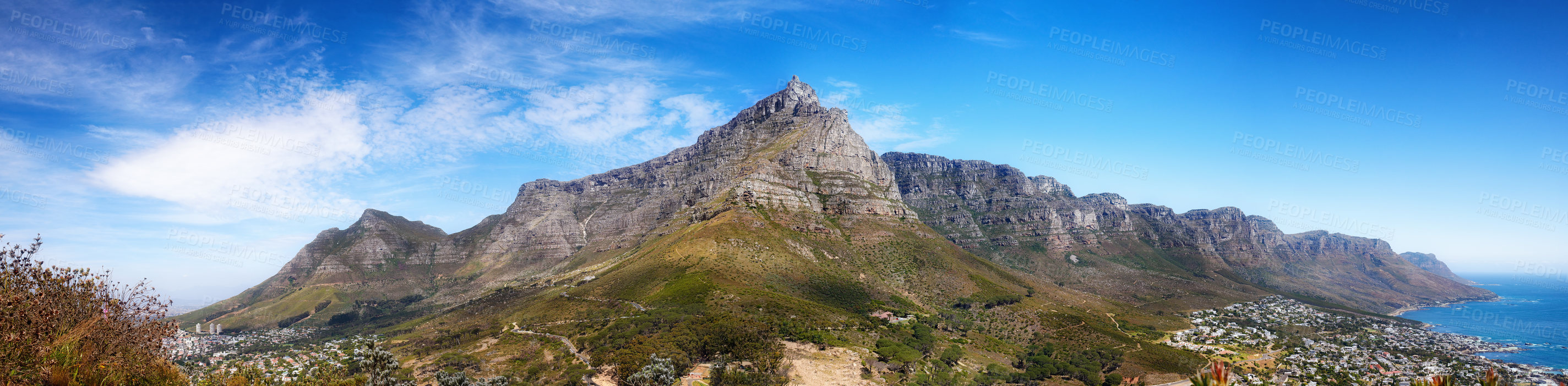 Buy stock photo Landscape panorama of mountains, sea and coastal city with blue sky in famous travel and tourism destination. Copy space and scenic nature view of Table Mountain reserve in Cape Town, South Africa