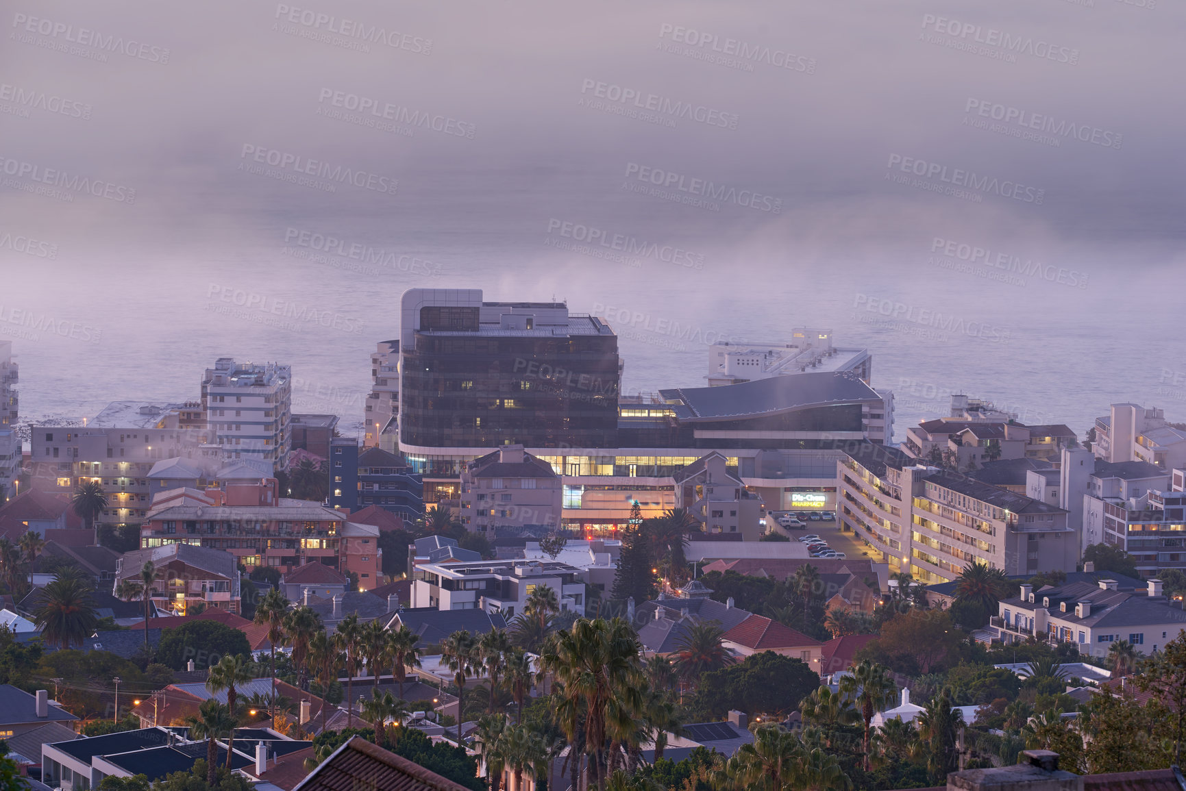 Buy stock photo City view of building lights on a cold winter day. Outdoor, streets and architectural detail around foggy background in a town. Tall palm trees, life in an urban coastal town 