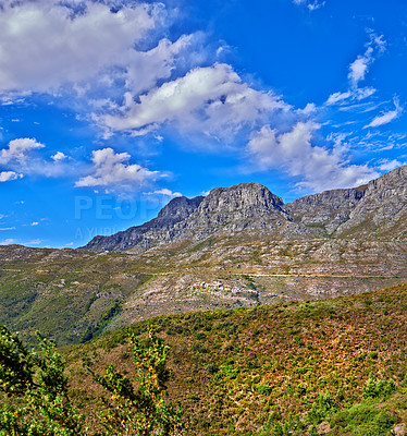 Buy stock photo Beautiful mountain in peaceful rocky land on a sunny day in Cape Town. Vibrant land with lush green bushes and plants growing with harmony in nature. Relaxing, soothing views of South Africa