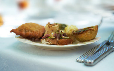 Buy stock photo Closeup of savoury snacks served on porcelain plate and dish at a high tea event or fine dining restaurant. Texture detail of tasty pastry, pies and antipasto bread with meat for eating and tasting