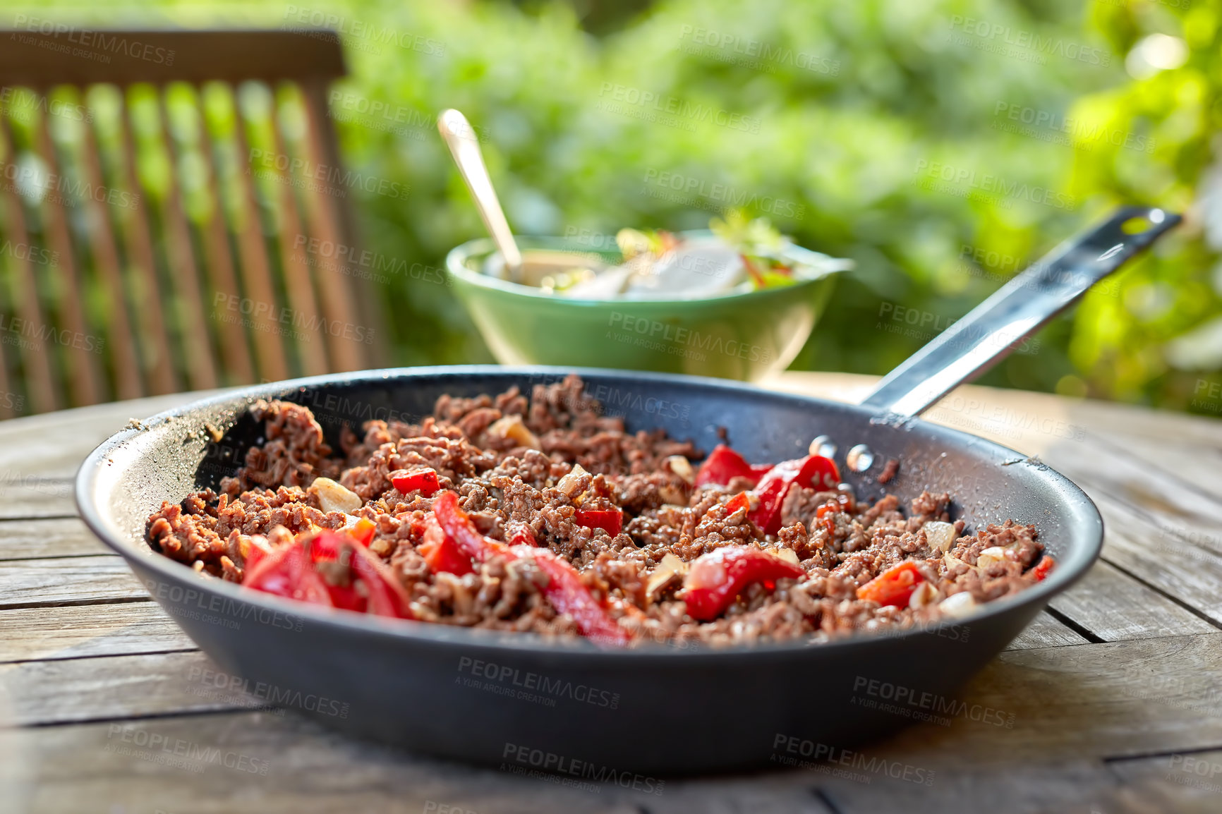 Buy stock photo A delicious meal with cooked beef meat and pepper vegetables. Chili con carne stew dish served for dinner at an outdoors restaurant. Texture detail of spicy homemade food in a pan on a table