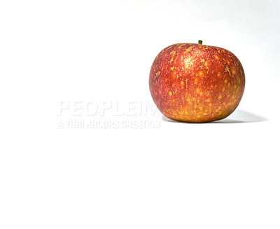 Buy stock photo Closeup of a red apple in studio isolated on a white background. Eat healthy and watch your diet. Fruit contains essential vitamins to boost your immunity. A snack vegans and vegetarians can enjoy