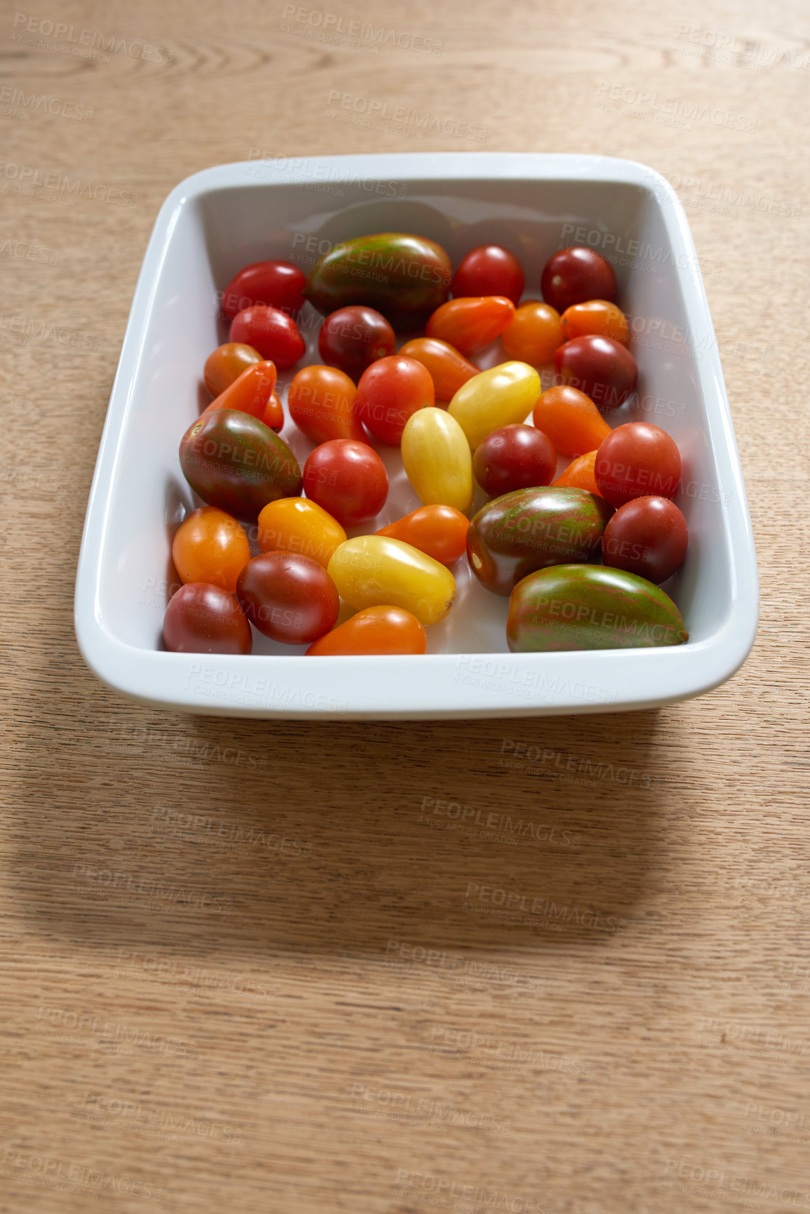 Buy stock photo Fresh harvested colorful tomatoes. Group of healthy multi colored and organic cherry tomato vegetables or delicious fruit, perfect for raw summer salads or veggie platters 