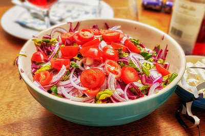 Buy stock photo Shot of a healthy handmade salad in a bowl on the kitchen counter at home