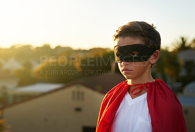 Buy stock photo Shot of a young boy in a cape and mask playing superhero outside