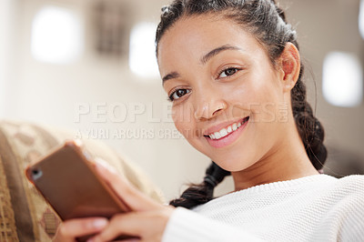 Buy stock photo Living room, portrait and woman with mobile phone on sofa for social media, communication or browsing internet in home. Weekend, smartphone and gen z person for texting, scrolling web and smiling