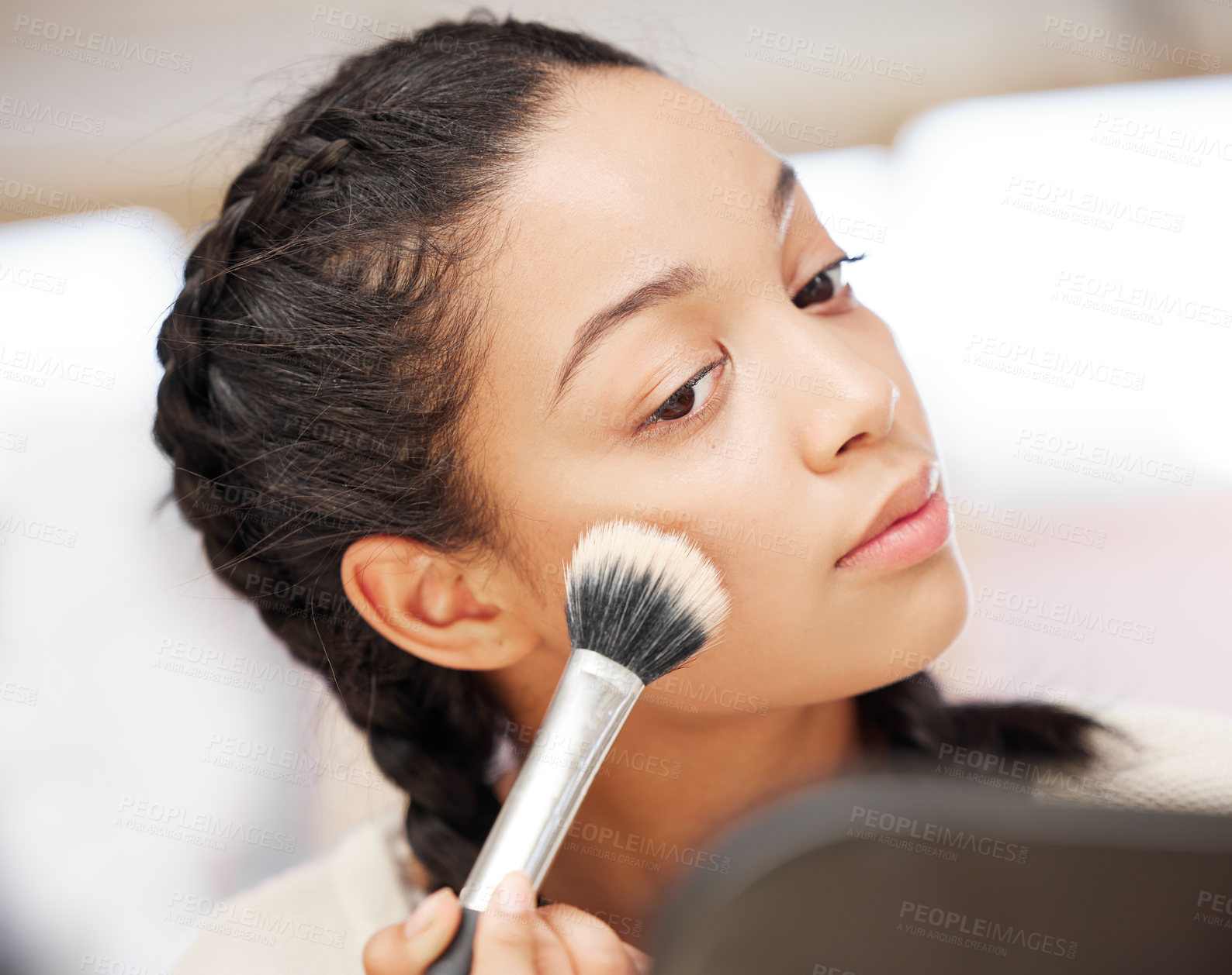 Buy stock photo Shot of a young woman applying makeup during her beauty routine at home