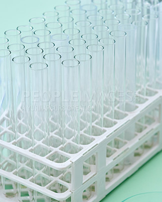 Buy stock photo Closeup shot of test tubes in a tray on a table in a lab