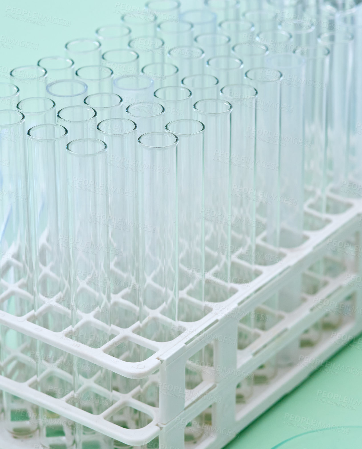 Buy stock photo Closeup shot of test tubes in a tray on a table in a lab