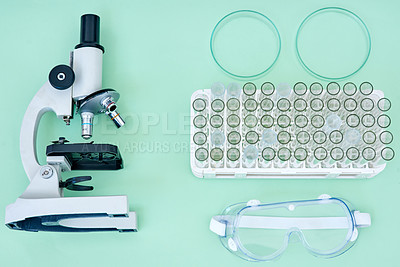 Buy stock photo Lab, tools and collection of equipment with microscope, test tube and safety goggles for medical research. Science, medicine and laboratory supplies for pharmaceutical study on studio background.