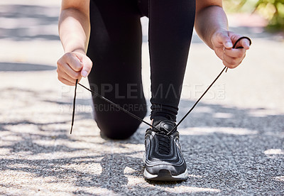 Buy stock photo Athlete, shoelaces and hands for runner, workout and nature for cardio exercise. Legs, footwear and sports outdoors or trail run, performance and training for health or marathon fitness preparation