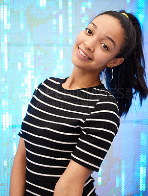 Buy stock photo Portrait of a happy young woman against a neon sequinned background