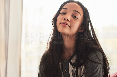 Buy stock photo Portrait of a beautiful young woman relaxing at home