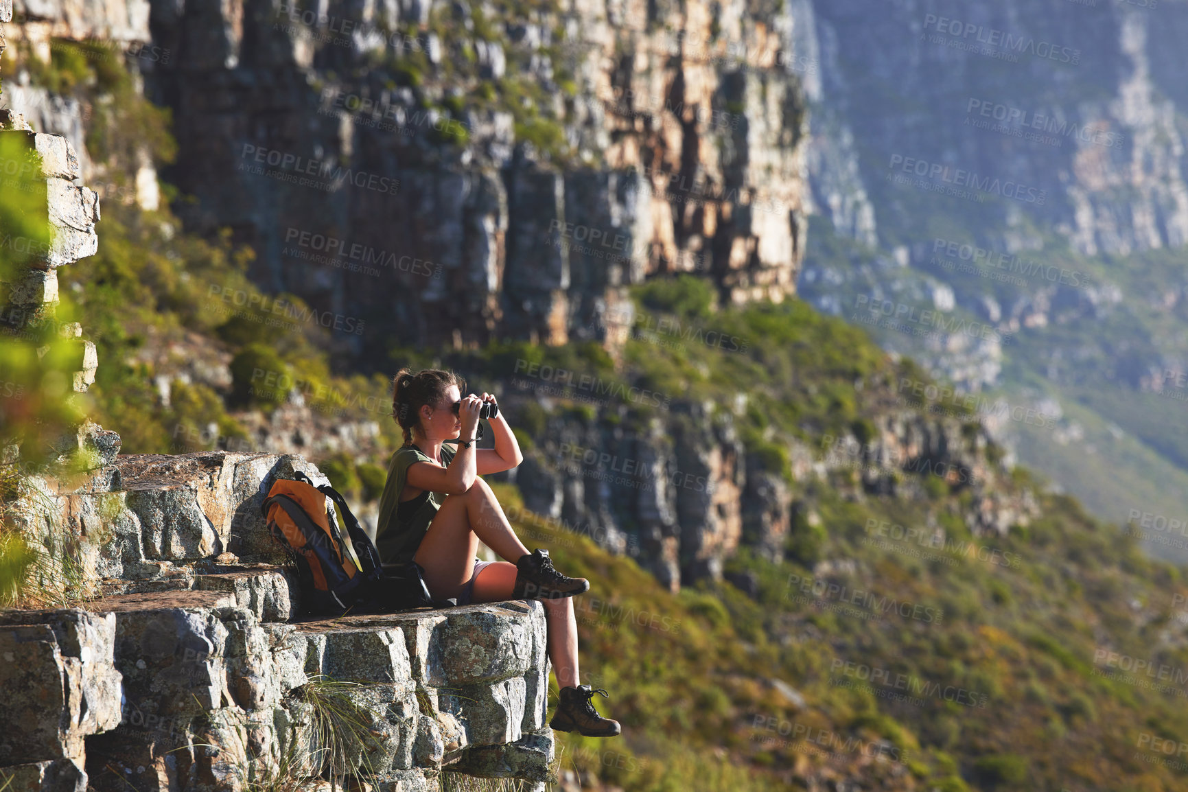 Buy stock photo Mountain, woman and hiking for fitness with binoculars on cliff to relax for explore, journey and trekking as backpack. Active, calm and sightseeing on adventure for health by physical exercise 