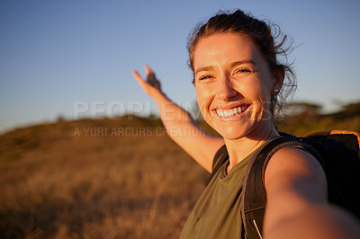Buy stock photo Shot of a young woman taking a selfie while out hiking