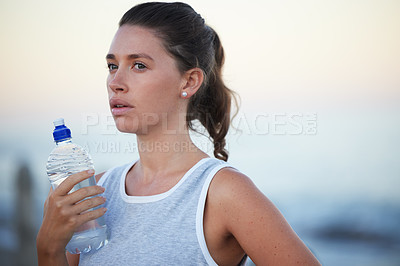 Buy stock photo Sports, woman and bottle for break, exercise and running outdoors in nature. Cardio, fatigue and breathe for tired female athlete for health and wellness, water and hydration for marathon training