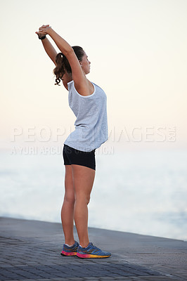 Buy stock photo Fitness, woman and arms for stretch by ocean, nature and running for cardio. Warm up, sports and muscle for tension relief for female athlete, runner and health or workout for endurance training