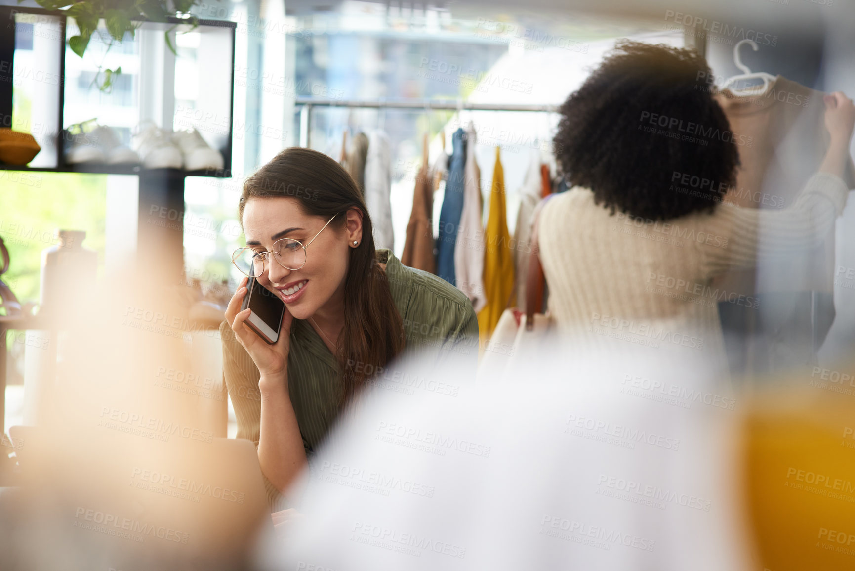 Buy stock photo Phone call, fashion and business woman in store for online order, communication and talking to client. Startup, retail boutique and worker on smartphone for conversation, contact and clothing stock