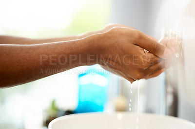 Buy stock photo Shot of an unrecognizable person rinsing their hands in a sink