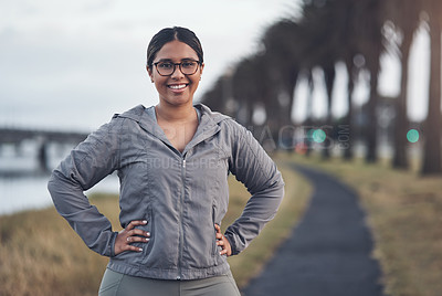 Buy stock photo Cropped shot of a young woman out for a run