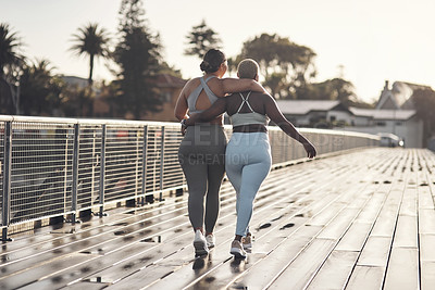 Buy stock photo Rearview shot of two young women out for a workout together
