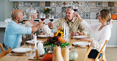 Buy stock photo Cheers, wine and family with dinner in home at dining room for celebration, bonding and gathering. Happy, toast and senior parents with adult children drinking champagne at supper together at house.