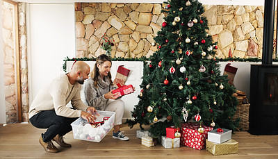Buy stock photo Christmas tree, gift or happy couple on holiday for boxes or presents in apartment, house or home. Smile, check or excited woman with xmas surprise with husband or mature man for festive celebration