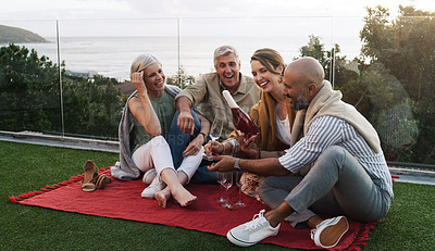 Buy stock photo Mature people, picnic and champagne in outdoor garden for friendship, celebrate or travel party reunion. Happy group, smile and laugh with wine for drinking, fun or sunset together or relax grass   