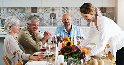 Buy stock photo Mature people, table and food for celebration, dinner party or reunion in home for holiday. Happy group, smile and event with wine for drinking, roast or hosting together in relax,  alcohol or social
